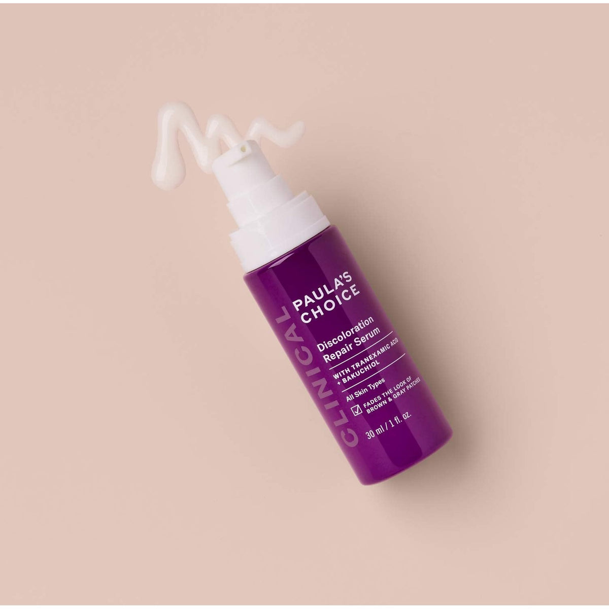 Paula's Choice Clinical Discoloration Repair Serum in a purple bottle, designed for brightening and evening skin tone.