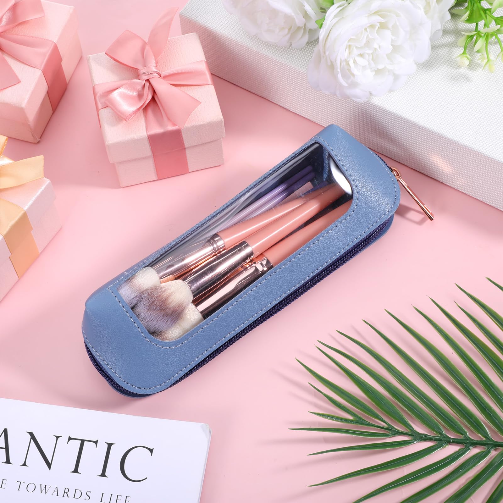 Stylish Psyqtsuary small clear makeup bag in PU leather, showcasing makeup brushes through a transparent window. 100% genuine.