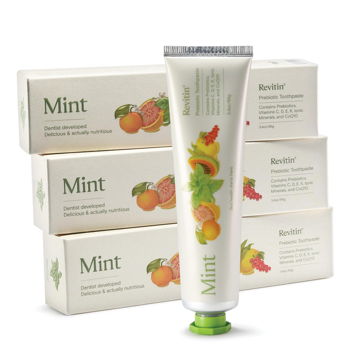 Revitin fluoride-free mint tooth gel in a stylish tube, surrounded by its original packaging, dentist-developed for nutritious oral care.