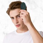 Stylish RHOS folding brush with mirror, designed for women, shown in use by a model for on-the-go grooming.
