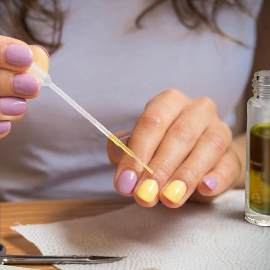 A set of 12 roller bottles for essential oils, displayed with a person applying oil onto their nails, showcasing its use.
