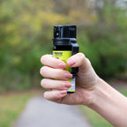 Premium imported SABRE Protector Dog Pepper Spray in hand, ideal for safety. Available at Curat Cart.