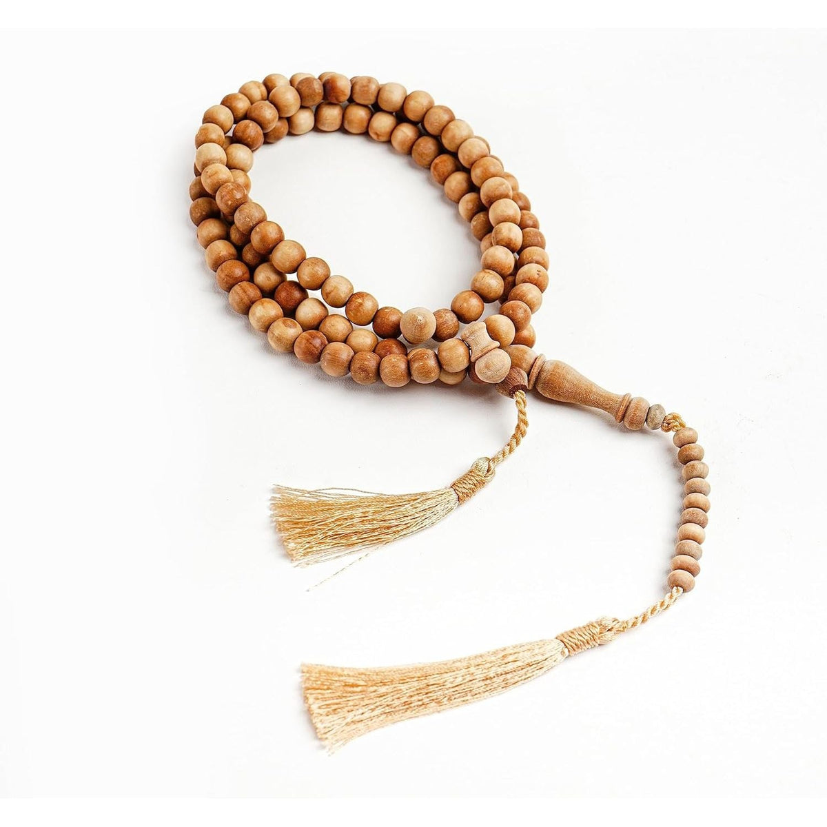 Authentic sandalwood tasbih prayer beads, beautifully crafted with tassels. Perfect for spiritual practice and meditation.
