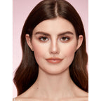 An image of a model showcasing a natural makeup look featuring the SHEGLAM Fine Line 2-In-1 Nose Contour & highlighting product.