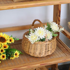 Wicker picnic basket with handle, adorned with artificial flowers. 100% Authentic, available at Curat Cart in India.
