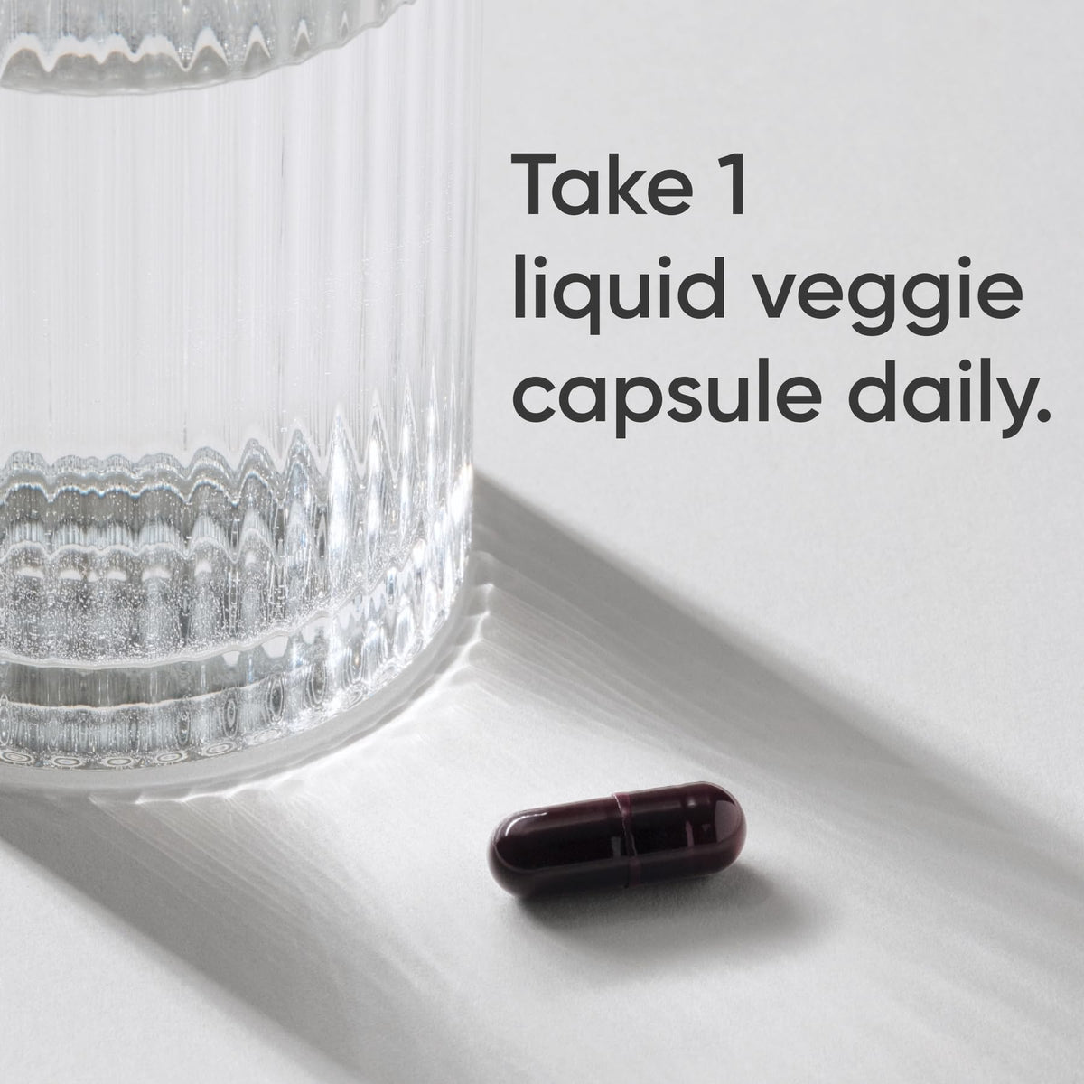 Premium Sports Research Iron Biglycinate capsule next to a glass, showcasing high-quality packaging at Curat Cart.