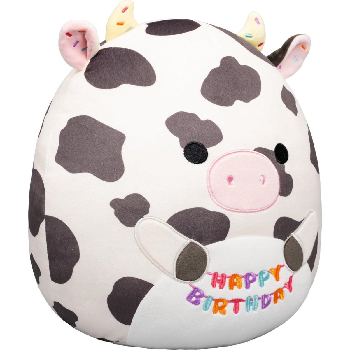 Colin the Cow Squishmallow is a 12-inch plush featuring a birthday theme. Available for order online, perfect for gifts.