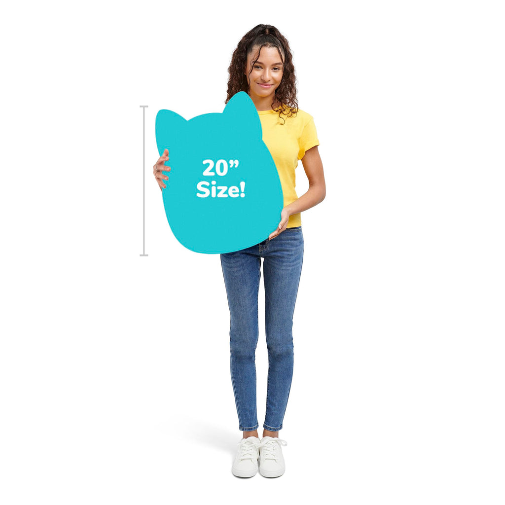 A young woman holds a sign indicating the 20-inch size of a plush Salami Squishmallow. Verified by CuratCart.