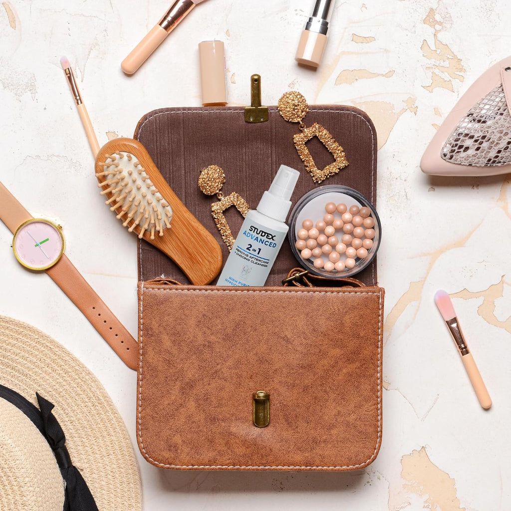 The Studex Advanced 2-in-1 Piercing Aftercare is a premium imported solution displayed in a chic cosmetic bag.