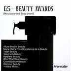 Nécessaire's Hand Retinol serum is showcased, highlighting 125+ beauty awards for trusted anti-aging solutions.