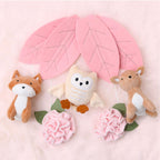 Charming Peanutshell Crib Mobile for Girls featuring adorable plush animals and floral accents. 100% Authentic, available at Curat Cart.