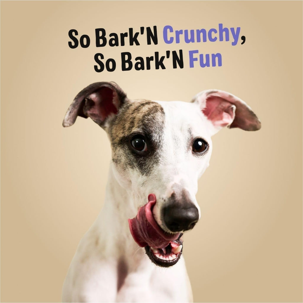 Delightful dog enjoying Three Dog Bakery Bark'n Crunch Chips, a premium imported snack from Curat Cart for your furry friend.