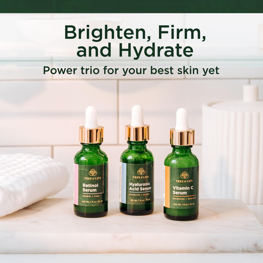Three green bottles of Tree of Life serums: Retinol, Hyaluronic Acid, and Vitamin C. Available for online order.