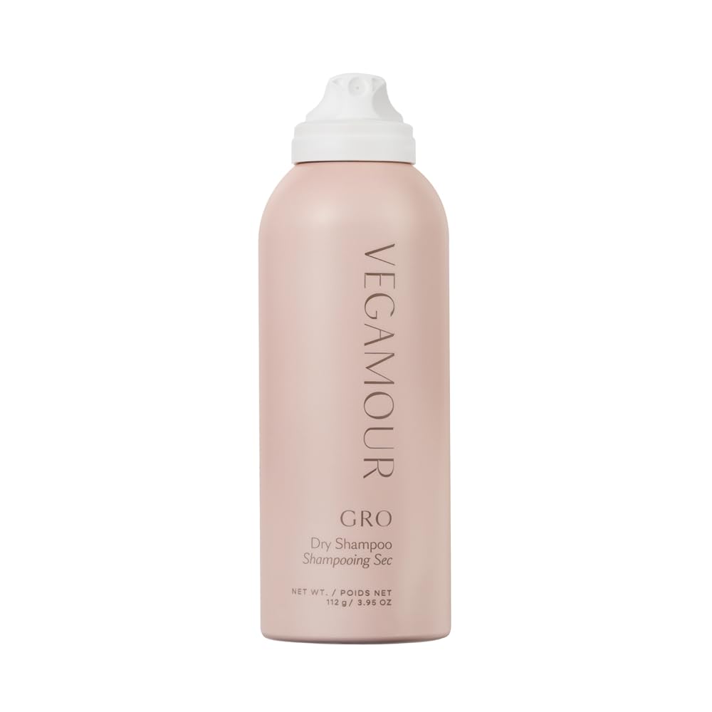 VEGAMOUR GRO Dry Shampoo in a sleek, pink bottle. Authentic formula for fresh, clean hair without water. 112g/3.96oz.