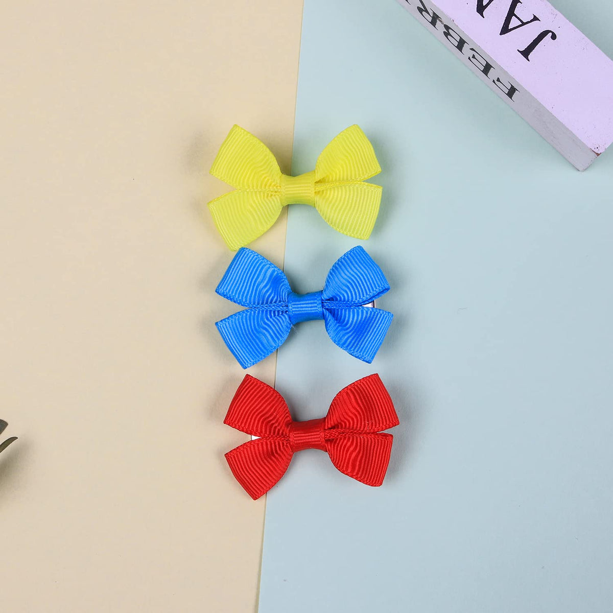 XIMA Hair Bows for Baby Girls in vibrant yellow, blue, and red colors, perfect for daily use. Available at Curat Cart.