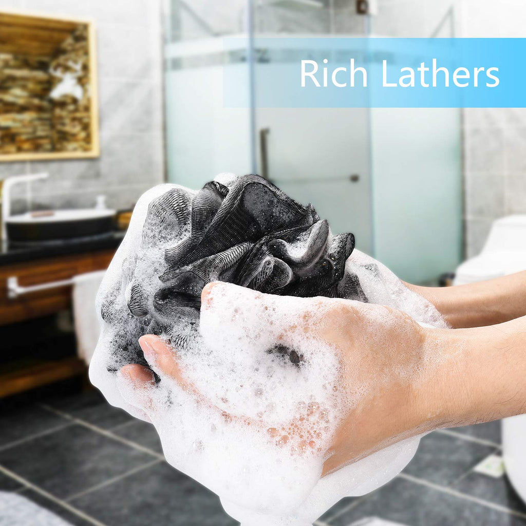 A person holds a black loofah sponge creating rich lathers in a modern bathroom. Verified by CuratCart for quality.