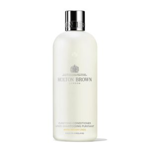 Molton Brown Purifying Conditioner, a premium imported product, offers luxurious hair care. Available at Curat Cart.
